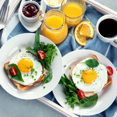 Traditional American breakfast on wooden tray