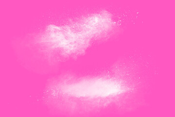Freeze motion of white particles on pink background. Abstract white dust explosion.