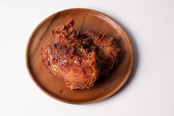 Pork fried rice on a dark tone wooden plate