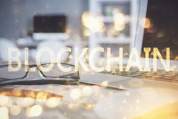 Crypto theme hologram with glasses on the table background. Concept of blockchain. Double exposure.