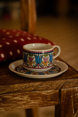 Coffee mug on a wooden chair