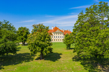 Fototapeta na wymiar Croatia, old town of Vukovar, city museum in old castle among the trees in park, classic historic architecture 