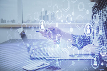 Social network theme hologram with businessman working on computer on background. Concept of world wide web. Double exposure.
