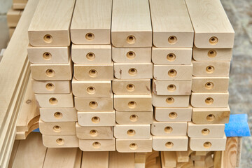 Joinery. Wooden table legs. Stacked wooden table legs in workshop