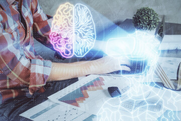 AR hologram with man working on computer on background. Augmented reality concept. Double exposure.