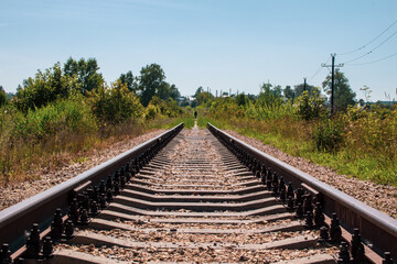 Railway tracks and gravel leading into the infinite distance