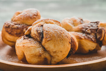 Freshly Baked Chocolate Bun Twist  Sprinkled with Powdered Sugar- Group Close Up 