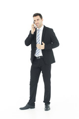 Handsome businessman in a suit hand holding smartphone and talking on the phone isolated on white background.Copy Space