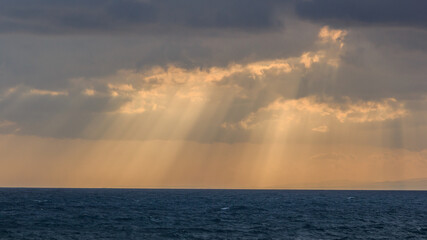 Fototapeta premium Sunrise Over The Ocean in a small beach located in Larnaca, Cyprus 