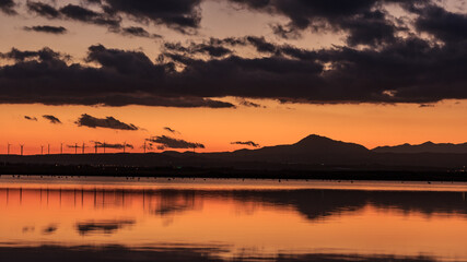 Beautiful mountain range landscape near a lake in a small village in Cyprus during sunset 
