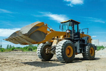 Wheel loader excavator at construction site