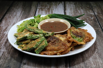 Set of spicy shrimp paste and vegetable on the plate. Famous ancient appetizer menu in Thai local restaurant. High fiber and low fat menu. 