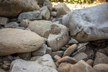 The rocky mountain foot. Smooth grey stones. The Carpathian mountains.