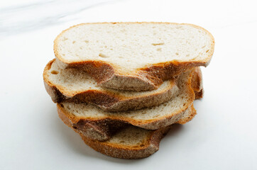 Closeup of stack slices of rye brad on the white background