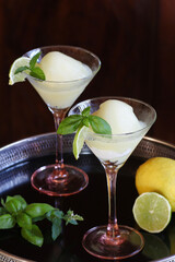 two fresh lemon sorbets in cocktail glasses