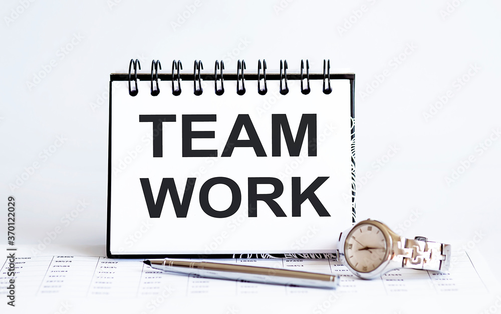 Poster word writing text team work on notepad. business concept with clock,pen and chart