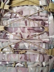 Straps and buckles on the tactical camouflage backpack
