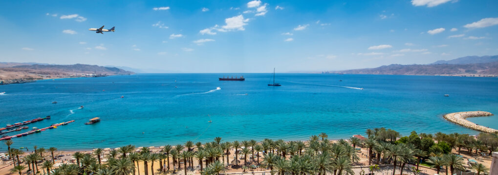 Panoramic image with a public beach at the Red Sea. Concept of unforgettable vacation and happy holiday

