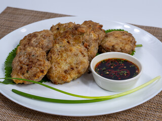 Korean food : Donjeonya(Donggeurangttaeng). A mixture of ground beef or pork and minced vegetables molded into round shapes, flour-coated, egg-battered, and pan-fried.