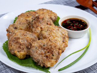 Korean food : Donjeonya(Donggeurangttaeng). A mixture of ground beef or pork and minced vegetables molded into round shapes, flour-coated, egg-battered, and pan-fried.