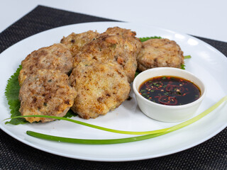 Korean food : Donjeonya(Donggeurangttaeng). A mixture of ground beef or pork and minced vegetables molded into round shapes, flour-coated, egg-battered, and pan-fried.