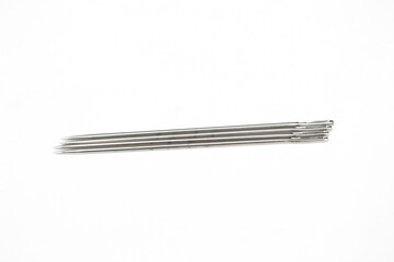 Sewing needle isolated on white background.
