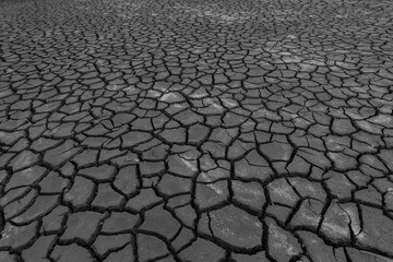 Earth ground crack with dust and rough dry surface texture ,Drought land lack of water. Global warming and greenhouse effect concept.