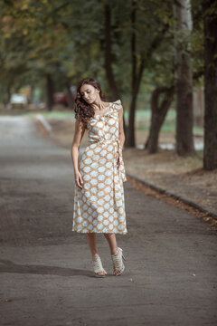 Fototapeta Fashionably dressed woman on the streets of a small Italian town