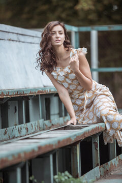 Fototapeta Fashionably dressed woman on the streets of a small Italian town