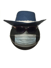 Mannequin head with sunglasses in a hat and in a protective mask isolated on a white background.