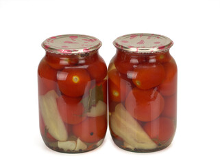 Canned and preserved tomatoes in glass jars isolated on white. Homemade pickled vegetables. Healthy fermented food.