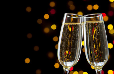 Close-up of two glasses with bubbly champagne
