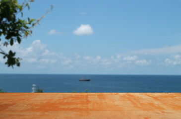 Beautiful pattern of empty brown plank wooden board with beautiful blurred relaxing on the beach for the background.