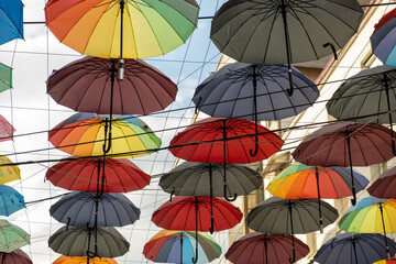 A group of different colored umbrella In ROmania in center of Iasi Town in a summer day. High quality photo