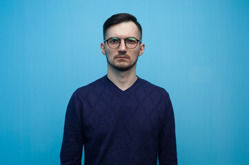 Fototapeta premium Serious young man in glasses