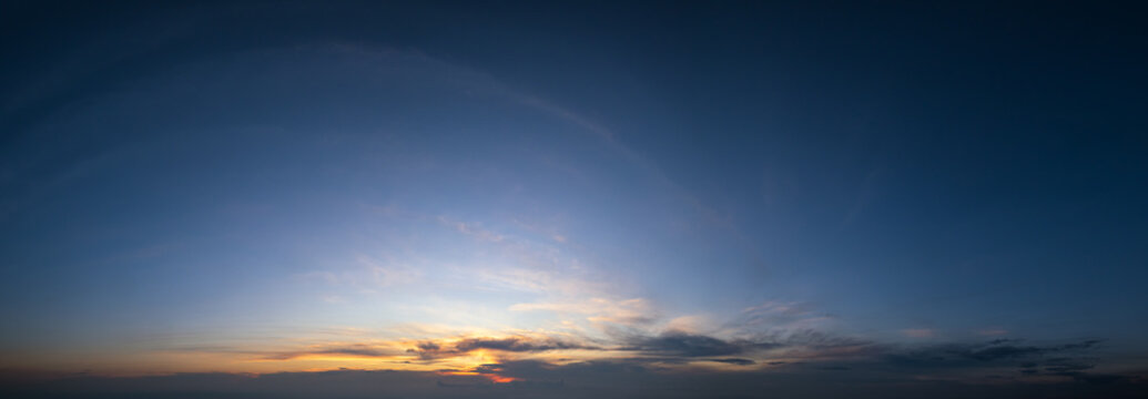 Sunset dusk sky with clouds (wide background panorama). © wildman