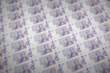 20 British pounds bills printed in illegal money production conveyor. Collage of many fake bills....
