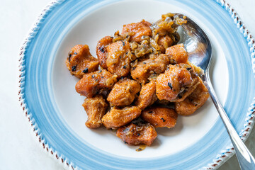 Fellah Koftesi Traditional Food. (Turkish cuisine) Polpettes From Bulgur or Bulghur and Semolina in Tomato Sauce with Parsley.