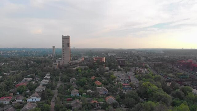 Industrial mining building red iron ore aerial drone forward push in camera movement Krivoy Rog Ukraine