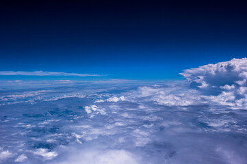 Fototapeta na wymiar Aerial view of the fantastic and curious clouds, View on an airplane,