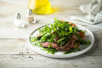 Arugula salad with grilled beef steak