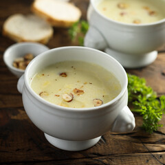 Homemade white asparagus soup with hazelnut