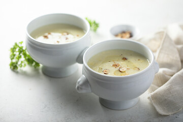 Homemade white asparagus soup with hazelnut