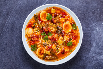 Minestrone, italian vegetable soup with pasta and beans.