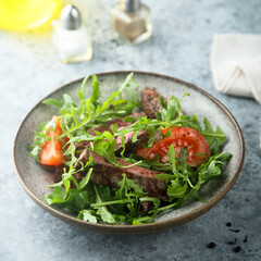 Arugula salad with grilled beef steak