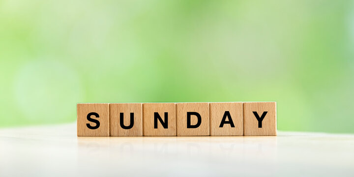 Sunday text in a wooden cube for banner or background web