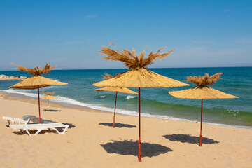 Fototapeta na wymiar Umbrellas on the beach, St. Constantine and Helena resort, Varna province, Bulgaria