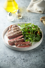 Grilled beef steak with green salad
