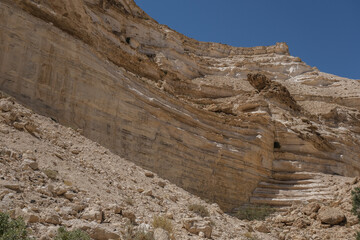 Fototapeta premium Ein Avdat National Park entrance into the deep canyon, carved by Zin streem, located at the foot of Midreshet Ben Gurion in Kibbutz Sde Boker, Negev desert, Israel.