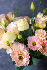 Bouquet of Eustoma flowers (Lisianthus flower) with pink soft blooms close-up. Vertical background.